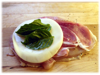 provolone and basil on prosciutto