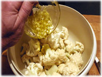 garlic and oil on cauliflower pieces 